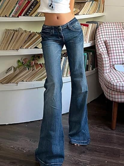 Dark blue low-rise flared jeans styled with a cropped white top